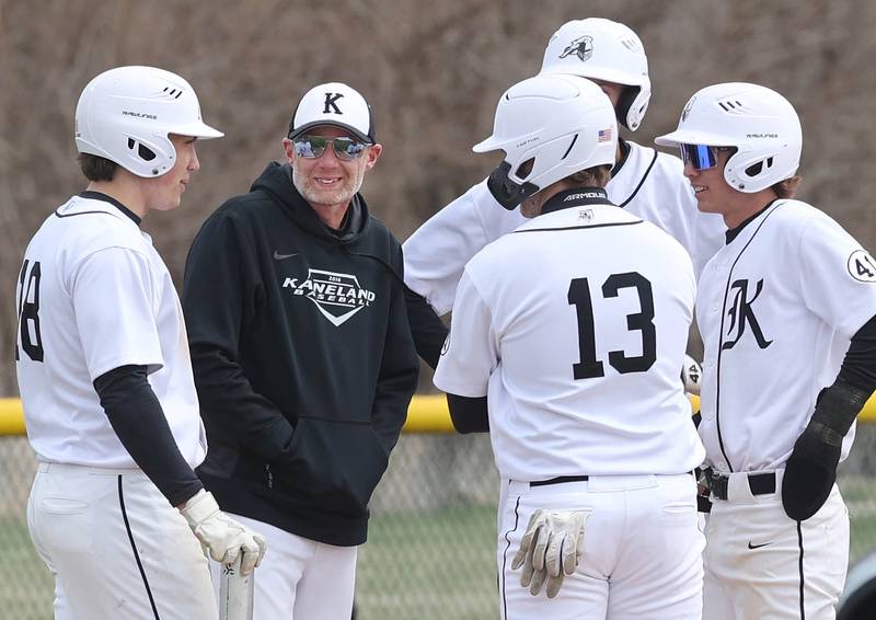 Kaneland baseball head coach Brian Aversa talks to his players during a break in the action in their game against DeKalb Friday, April 15, 2022, at Kaneland High School in Maple Park.