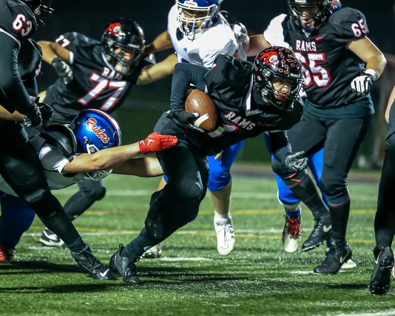 Glenbard East's Matthew Larson (1) runs up the middle during football game between Glenbard South at Glenbard East.   Oct 13, 2023.