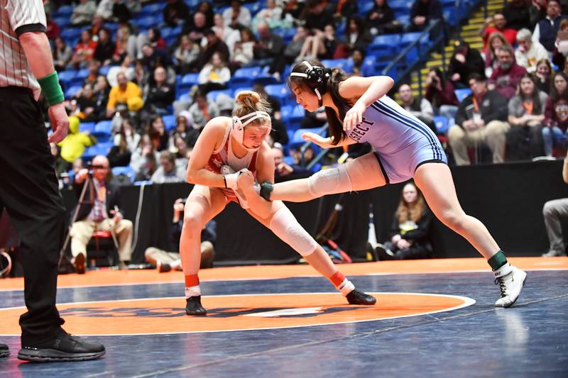 Claudia Heeney of Lockport Township, left, and Viola Pianetto of Mt. Prospect wrestle in the 135-pound championship match in the IHSA Girls Individual State Finals on Saturday, March 1. Heeney took first place over Pianetto.