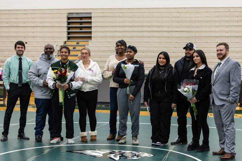 Plainfield Central seniors and their families join coaches during the Senior Night ceremony before the match at Plainfield Central on January 13, 2025.