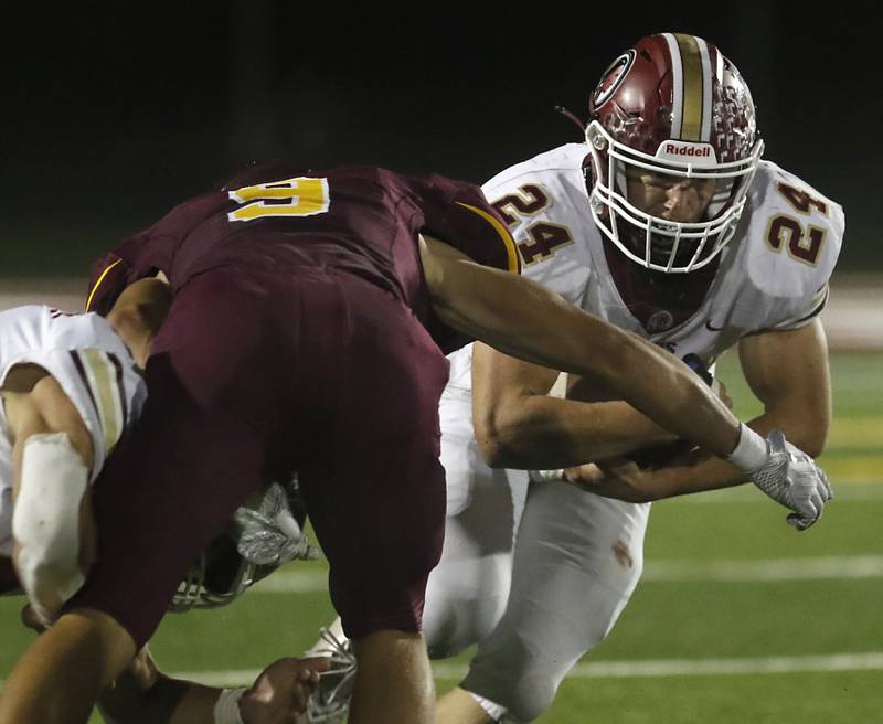 Morris’ Ashton Yard tries to run through the tackle attempt of Richmond-Burton's Daniel Kalinowski during a Kishwaukee River Conference / Interstate 8 Conference crossover football game Friday, Sept. 30, 2022, between Richmond-Burton and Morris at Richmond-Burton Community High School in Richmond.