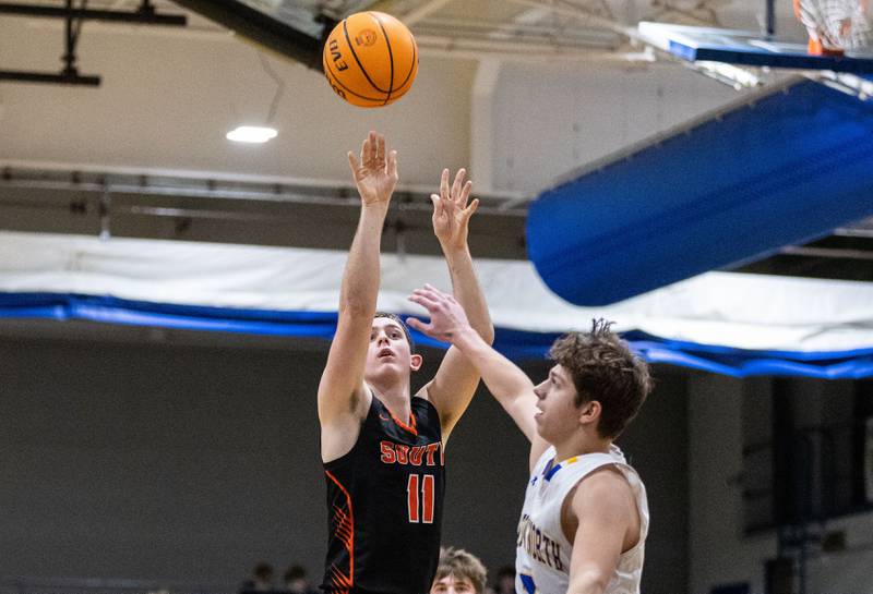 Wheaton Warrenville South’s Zach Rogers shoots a two-point field goal during a game against Wheaton North on Friday, Dec. 20, 2024.