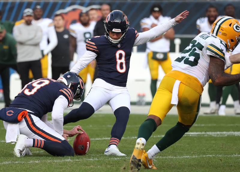 Chicago Bears place kicker Cairo Santos kicks the ball out of the hold of Chicago Bears punter Tory Taylor but it was blocked by Green Bay Packers defensive end Karl Brooks as time expired sealing the win for the Packers Sunday, Nov. 17, 2024, during their game at Soldier Field in Chicago.