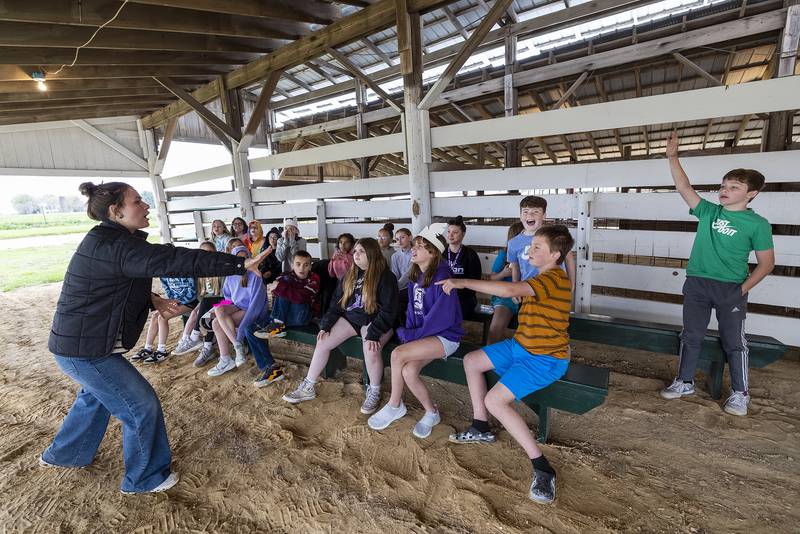 Natalie Pratt, an Ag Expo volunteer, quizzes fifth graders on the many uses of corn Friday, April 25, 2025.