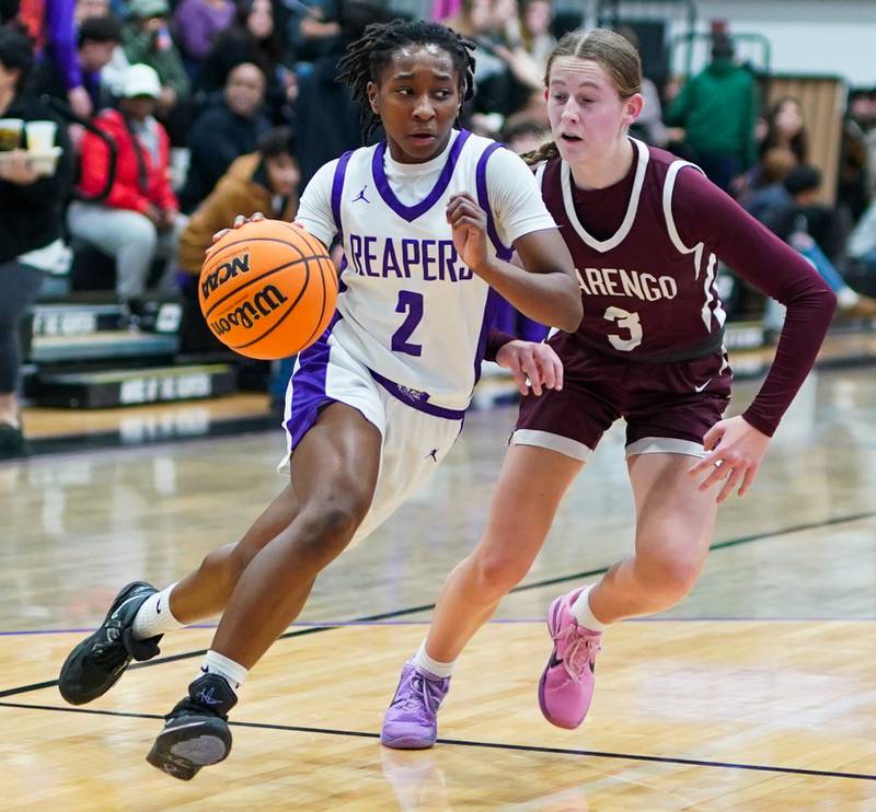 Plano’s Sania Young (2) drives to the hoop against Marengo's Maggie Hanson (3) during a basketball game at Plano High School on Wednesday, January 29, 2025.