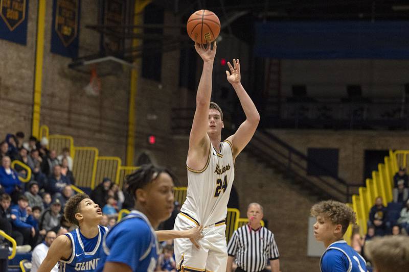 Sterling’s Lucas Austin puts up a three point shot against Quincy defenders Friday, Jan. 27, 2023.