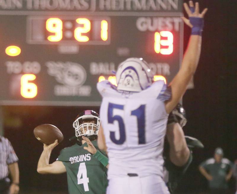 St. Bede's quarterback John Brady, (no,4) throws the ball down the field as Princeton's Bennett Graham Wiliams (no,51) tries to block his pass on Friday Oct. 8, 2021.