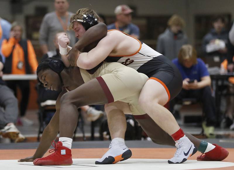 Crystal Lake Central’s Tommy McNeil controls St. Ignatius’ Melson Nagassa as they compete in the 215-pound third-place match in the IHSA 2A Crystal Lake Central Wrestling Sectional on Saturday, Feb. 15, 2025, at Crystal Lake Central High School.