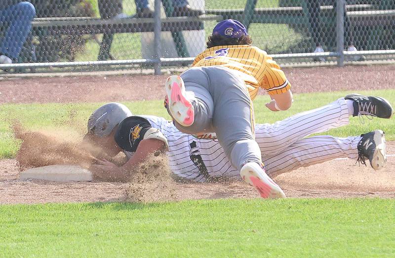 Putnam County's Traxton Mattingly slides safely into third basea after hitting a triple as Mendota's Oscar Castaneda misses the tag on Friday, May 8, 2026 at Putnam County High School.