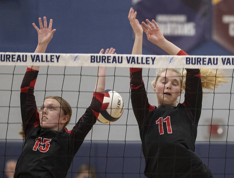 Erie-Prophetstown’s Kaylee Keegan (left) and Lauren Abbott work for a block against El Paso-Gridley Thursday, Nov. 7, 2024, during the class 2A volleyball sectional championship at Bureau Valley High School.