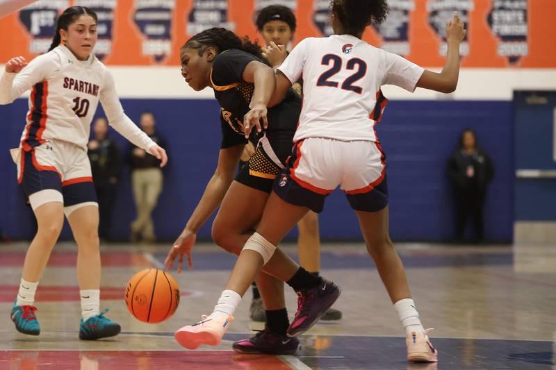 Joliet West’s Jada Thompson dives around a Romeoville defender on Thursday, Jan. 29, 2026 in Romeoville.