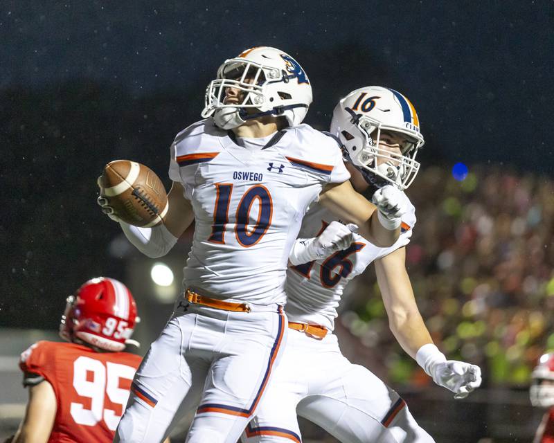 Oswego's Mariano Velasco (10) celebrates his touchdown run after catch during football game between Oswego at Naperville Central  on Friday, Aug 29, 2025  in Naperville.