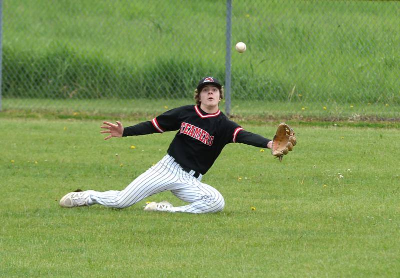 Fulton's Evan Folk dives for a hit in right field against Forreston at the 1A Amboy Regional on Saturday, May 24, 2025.