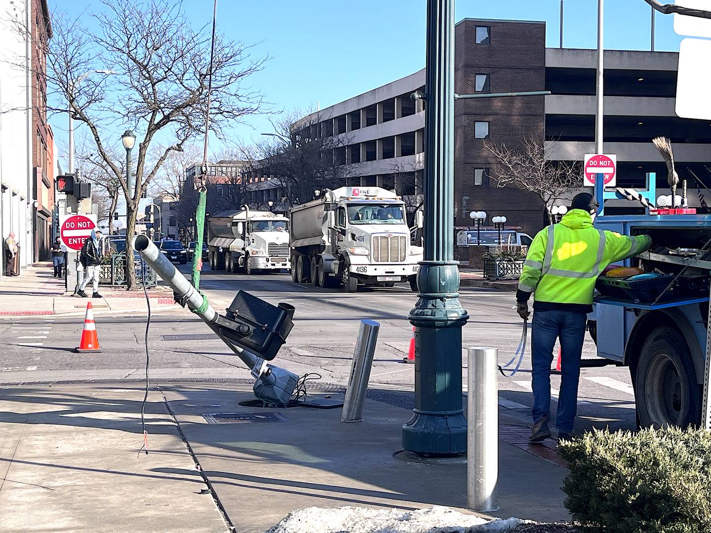 A damaged traffic signal seen on Feb. 13, 2026, near the Will County Courthouse in downtown Joliet.