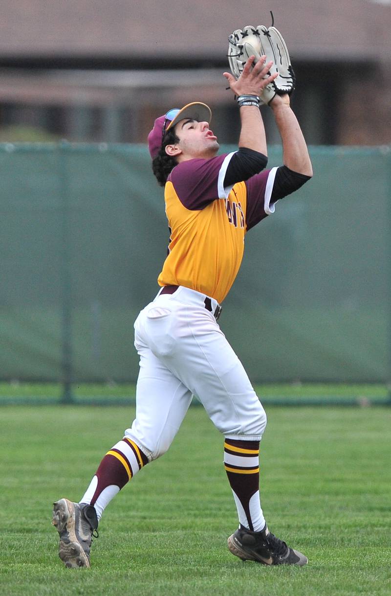 Montini left fielder AJ Manganello makes a putout during a game against Benet on Apr. 28, 2022 at Benet Academy in Lisle.