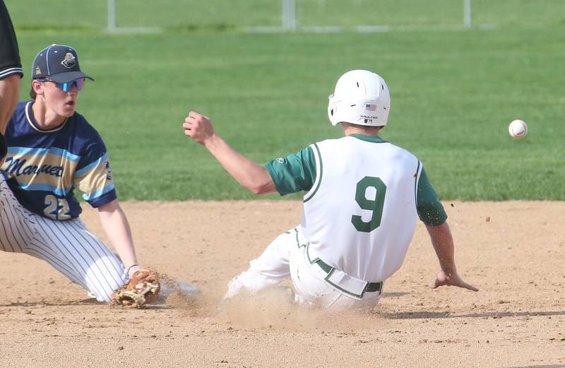 St. Bede's Geno Dinges steals second base as the the throw gets away from Marquette's Griffin Dobberstein on Thursday, April 24, 2025 at St. Bede Academy.