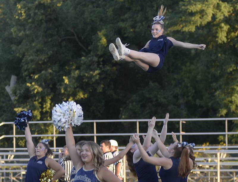 The Marquette Cheerleaders rev up the home field fans at the start of the game against Madison Friday at Marquette