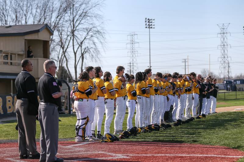 Joliet West stands for the playing of the National Anthem before their varsity baseball game versus Oswego East.  April 10, 2023.