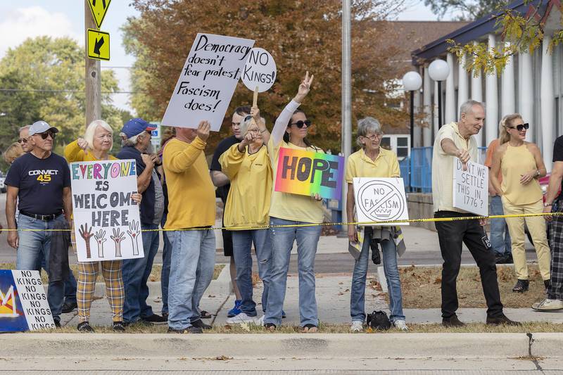 Protesters line Fourth Street in Sterling on Saturday, Oct. 18, 2025, joining hundreds of others showing their discontent with the Trump administration. The “No Kings” demonstration was just one of thousands across the United States and Europe.