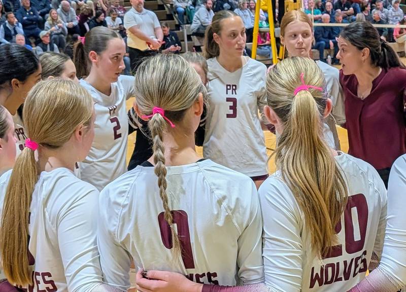 Prairie Ridge volleyball coach Leah Groat talks to her players during a timeout against Grayslake Central in a semifinal match of the Class 3A Carmel Sectional on Tuesday, Nov. 4, 2025, in Mundelein.