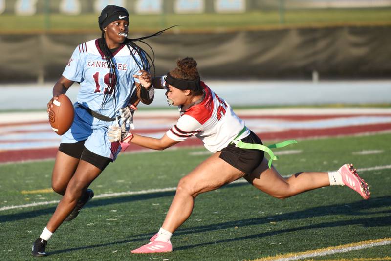 Kankakee's London Stroud, left, looks to throw as she's pressured by Bradley-Bourbonnais' Peyton Montgomery during the All-City game at Kankakee Wednesday, Sept. 17, 2025.