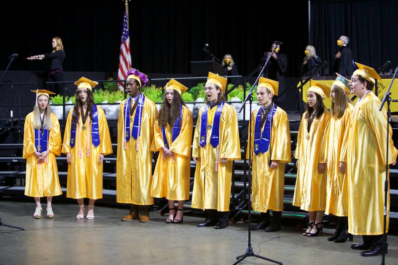 The choir performs at Jacobs High School graduation ceremony on May 21, 2022, at the NOW Arena in Hoffman Estates.