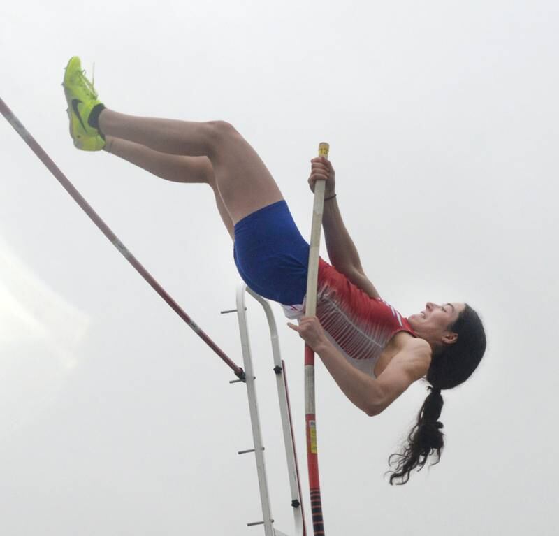 Oregon's Sonya Plescia extends to clear the bar in the pole vault competition at the 1A Winnebago Sectional on Friday, May 12. Plescia finished first in the event.