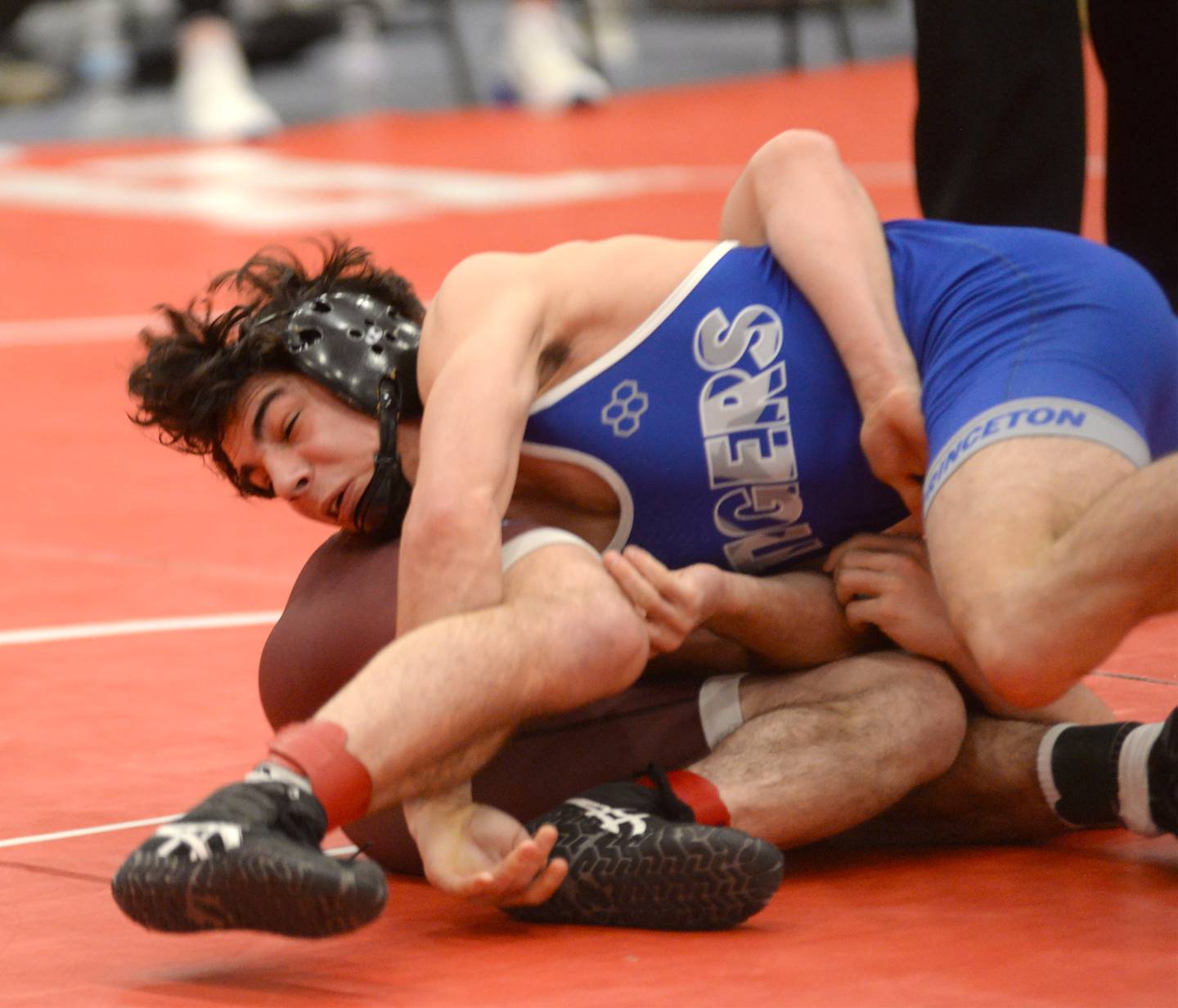 Princeton’s Ace Christiansen (top) and Richmond Burton’s Emmett Belson wrestle at 144 pounds at the 1A Oregon Sectional on Saturday, Feb. 15, 2025.
