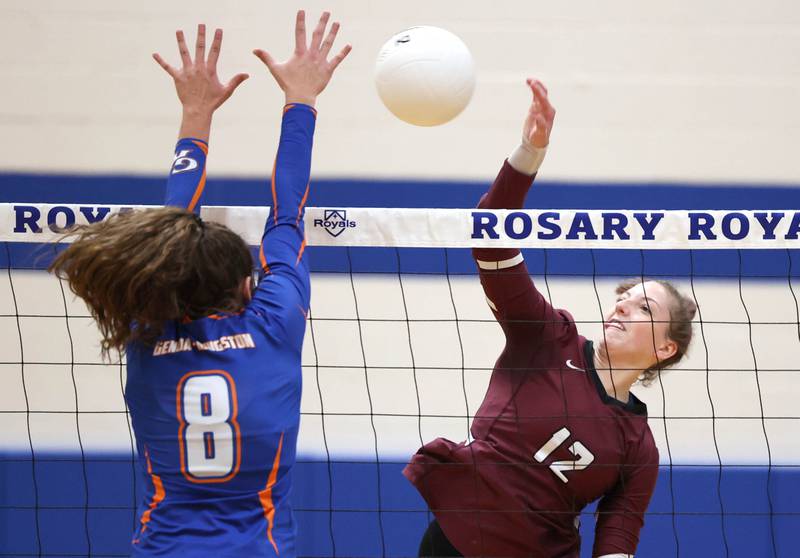 Marengo's Michaela Almeida tries to spike the ball past Genoa-Kingston's Alivia Keegan Thursday, Oct. 27, 2022, during their Class 2A Regional final match at Rosary High School in Aurora.