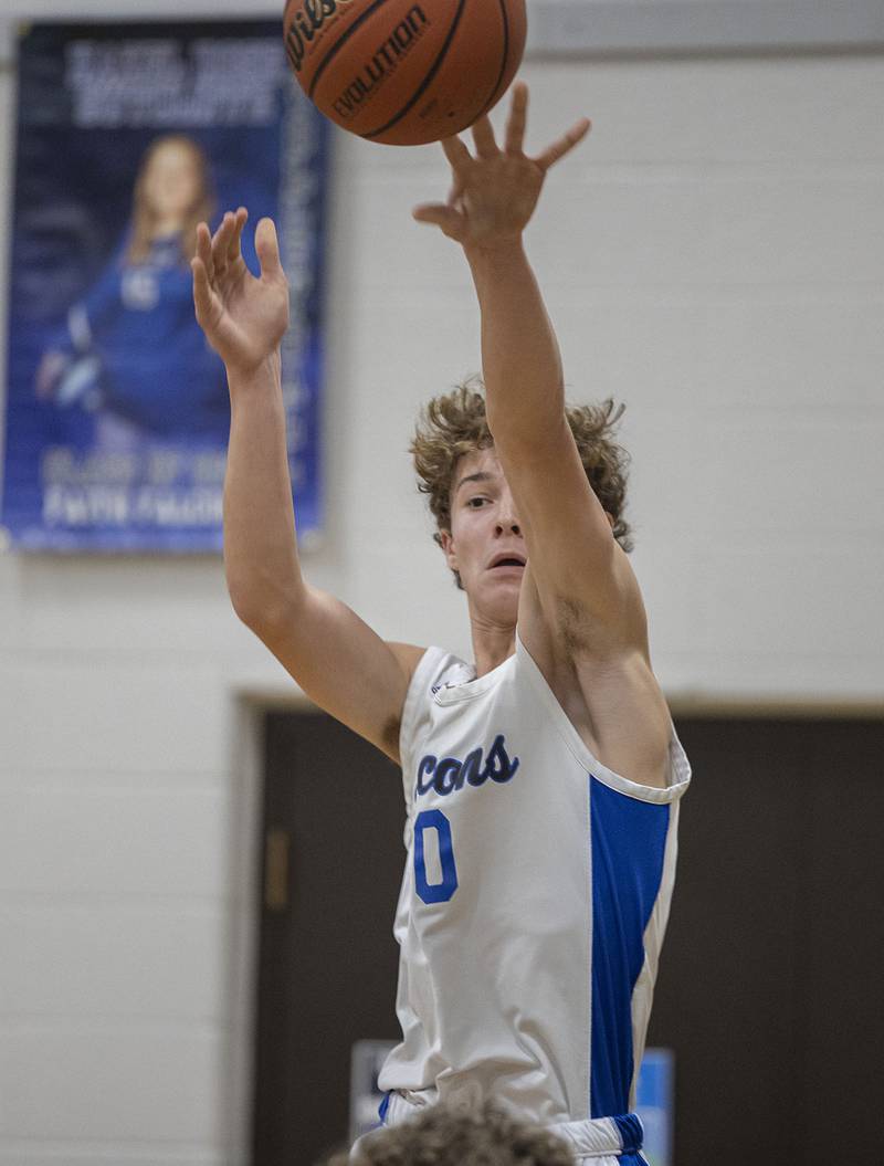 Faith Christian’s Brady Bivins makes a pass down low against QC Christian Tuesday, Dec. 9, 2025.
