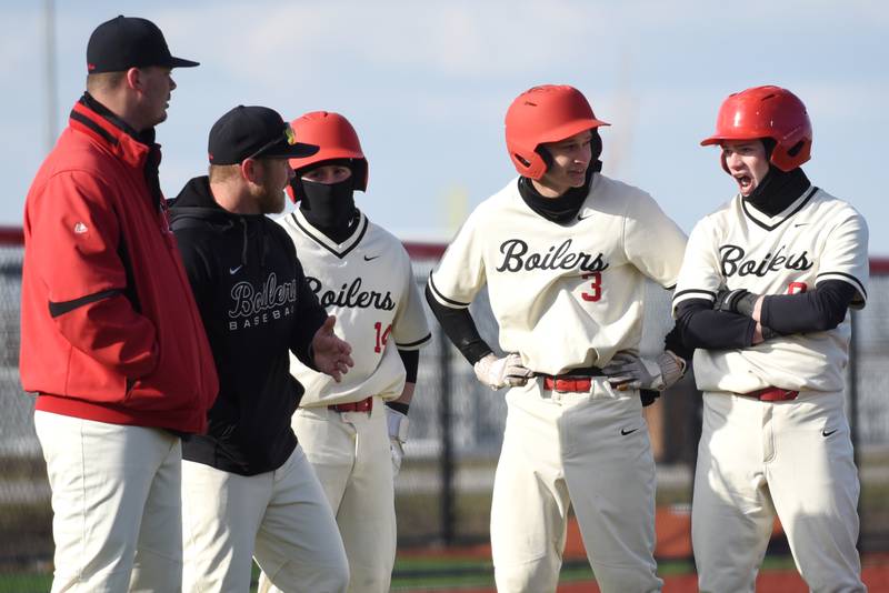 From left, Bradley-Bourbonnais assistant coach Kobe Shutter, head coach Brad Schweigert and players Tyson Arbour, Jackson Cieslik and Keaton Allison talk things over during a Kankakee pitching change in a game at 315 Sports Park in Bradley Friday, March 27, 2026.