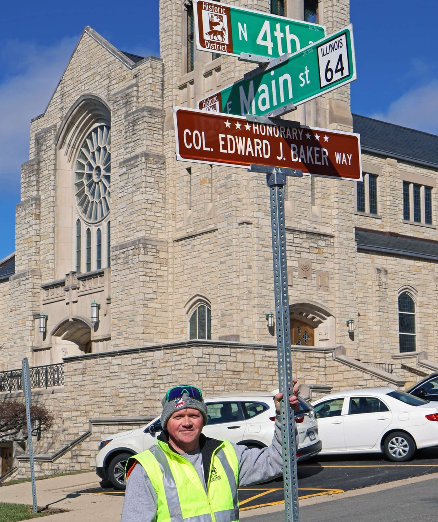 St. Charles city workers installed the honorary street sign for Edward J. Baker on Fourth Avenue, between East Main Street and Cedar Avenue.
