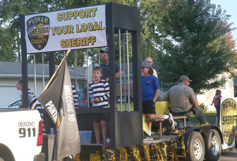 The Putnam County Sheriff float rides during the inaugural Homecoming parade on Wednesday, Sept. 17, 2025 down Elm Street in Granville.