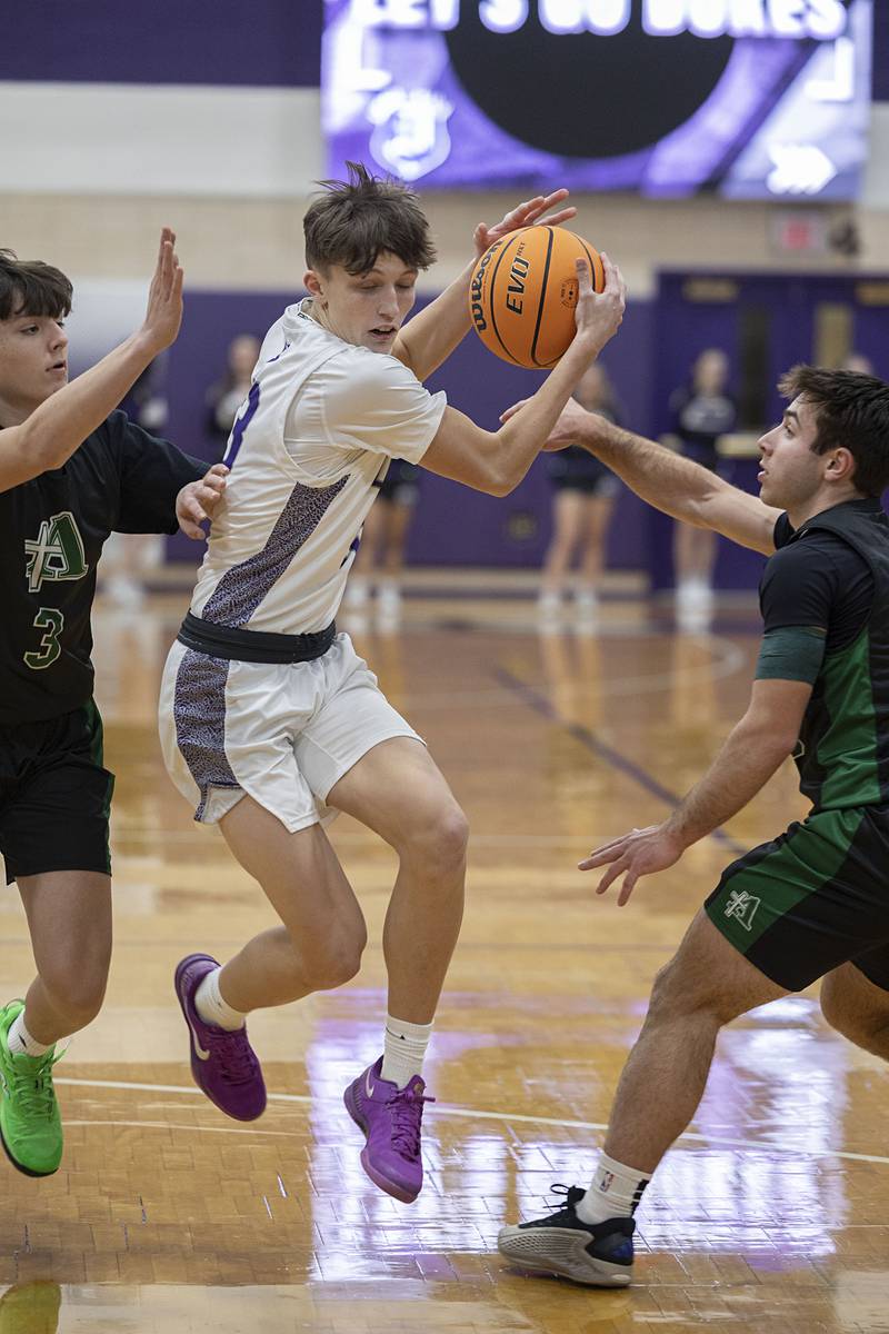 Dixon’s Beckham Rock handles the ball in the lane against Alleman Wednesday, Jan. 28, 2026.