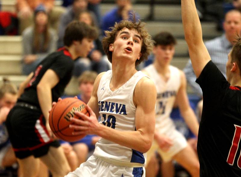 Geneva’s Jack Hatton looks for an opening during a game against Batavia at Geneva on Friday, Feb. 3, 2023.