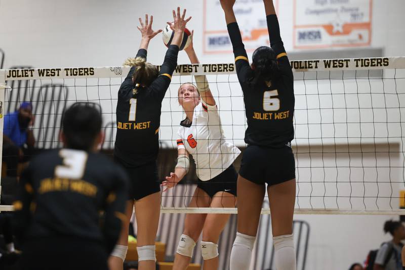 Minooka’s Kendall Kozak hits a shot against Joliet West on Tuesday, Sept. 26, 2023 in Joliet.