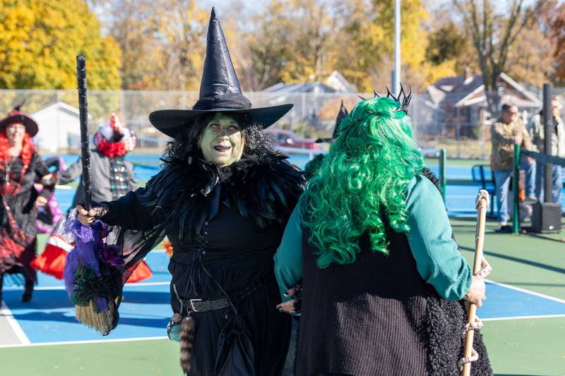 The “Hocus Pocus Hags” dance at the annual trick or treat at Washington park on Saturday, October 26, 2024 in Peru.