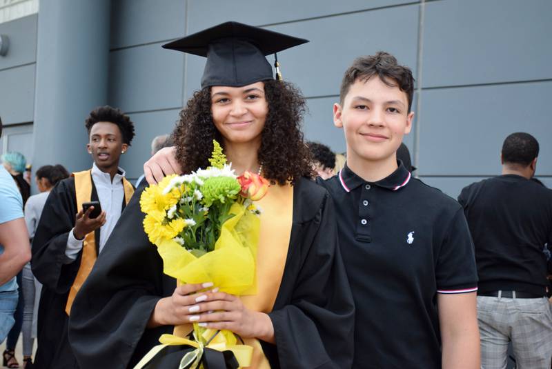 Graduate Jadan Spartz, left, and her 14-year-old brother Cristian pose for a photo together after the commencement ceremony of Sycamore High School's Class of 2022, held Sunday, May 22, 2022 at Northern Illinois University's Convocation Center in DeKalb.