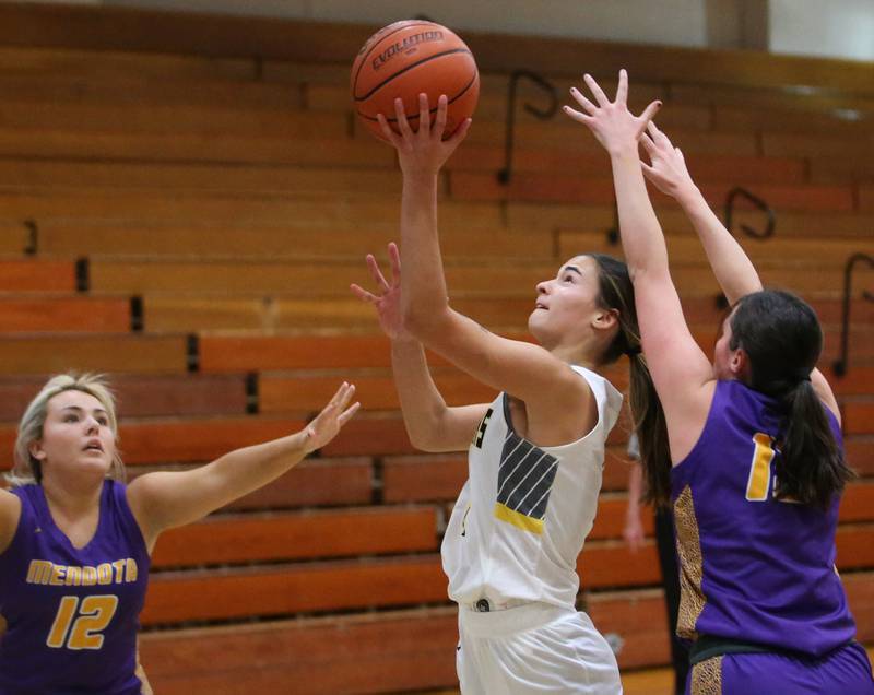 Putnam County's Ava Hatton runs in the lane to score between Mendota's Ryleigh Sondgeroth and teammate Grace Wasmer during the Princeton High School Lady Tigers Holiday Tournament on Tuesday, Nov. 14, 2023 in Prouty Gym.