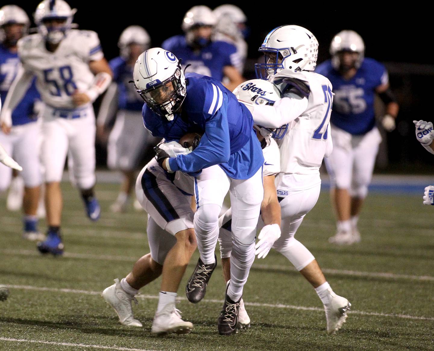 Geneva’s Talyn Taylor carries the ball during a home game against St. Charles North on Friday, Sept. 23, 2022.