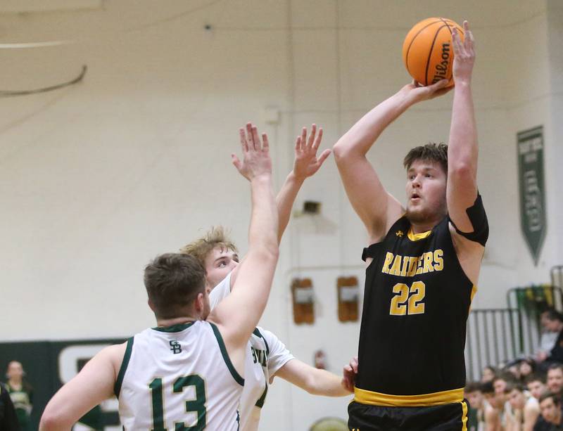Ashton-Franklin Center's Brock Lehman shoots a jump shot over St. Bede's Kaden Newman and Mason Ross during the Class 1A Regional quarterfinal game on Monday, Feb. 24, 2025 at St. Bede Academy.