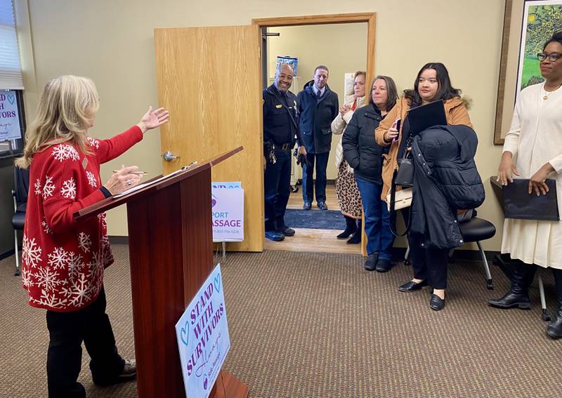 Christine Kalina (left), development director of Safe Passage Inc., speaks on Friday, Dec. 5, 2025, at a groundbreaking ceremony for the agency's new crisis shelter, expected to begin construction in the spring.