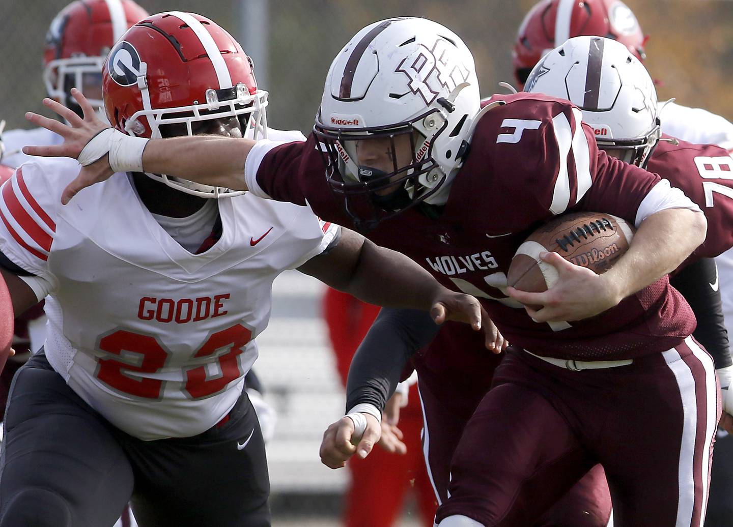 Prairie Ridge's Jack Finn stiff arms Chicago Goode's Thomas Davis as he runs the ball during an IHSA Class 5A first-round football game on Saturday, Nov. 2, 2024, at Prairie Ridge High School in Crystal Lake.
