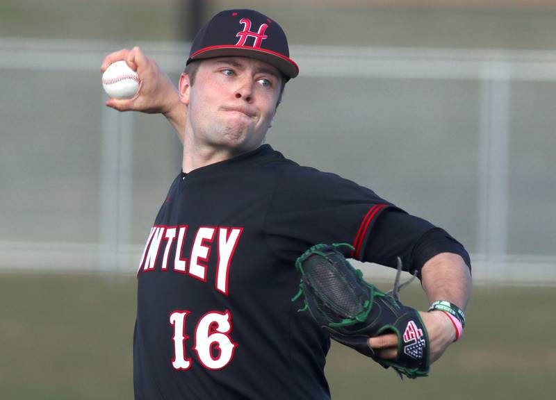 Huntley’s Malachi Paplanus makes an offering in varsity baseball at McHenry Friday night.