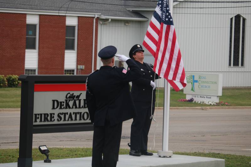 Members of the honor guard raise an American flag into the air  Thursday, Sept. 11, 2025, during the annual Patriot Day Ceremony.