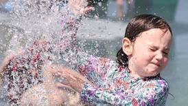 Photos: DeKalb County residents head to splash pads to stay cool