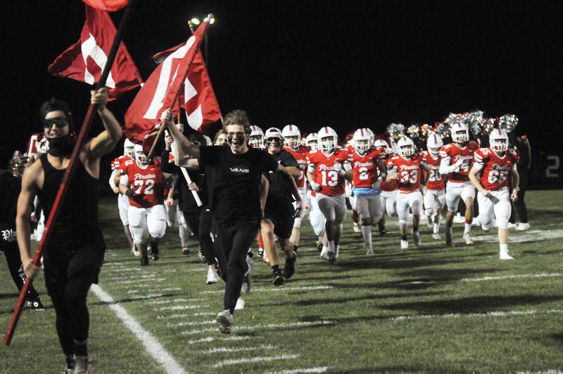 The Ottawa football team takes the field before the home game against Woodstock on Friday, Oct. 21, 2022.