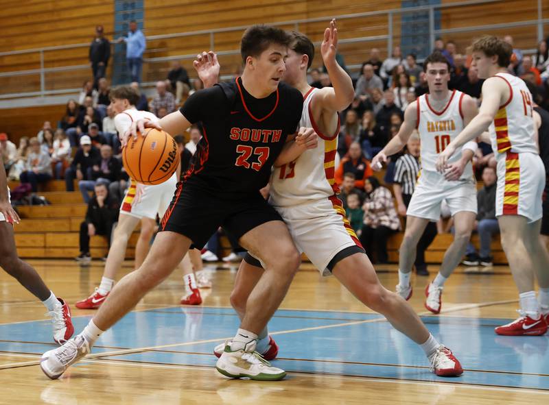 Wheaton Warrenville South's David Showman (23) drives under the basket during the IHSA boys class 4A Willowbrook regional final between Wheaton Warrenville South and Batavia on Friday, Feb. 27, 2026 in Villa Park, IL.