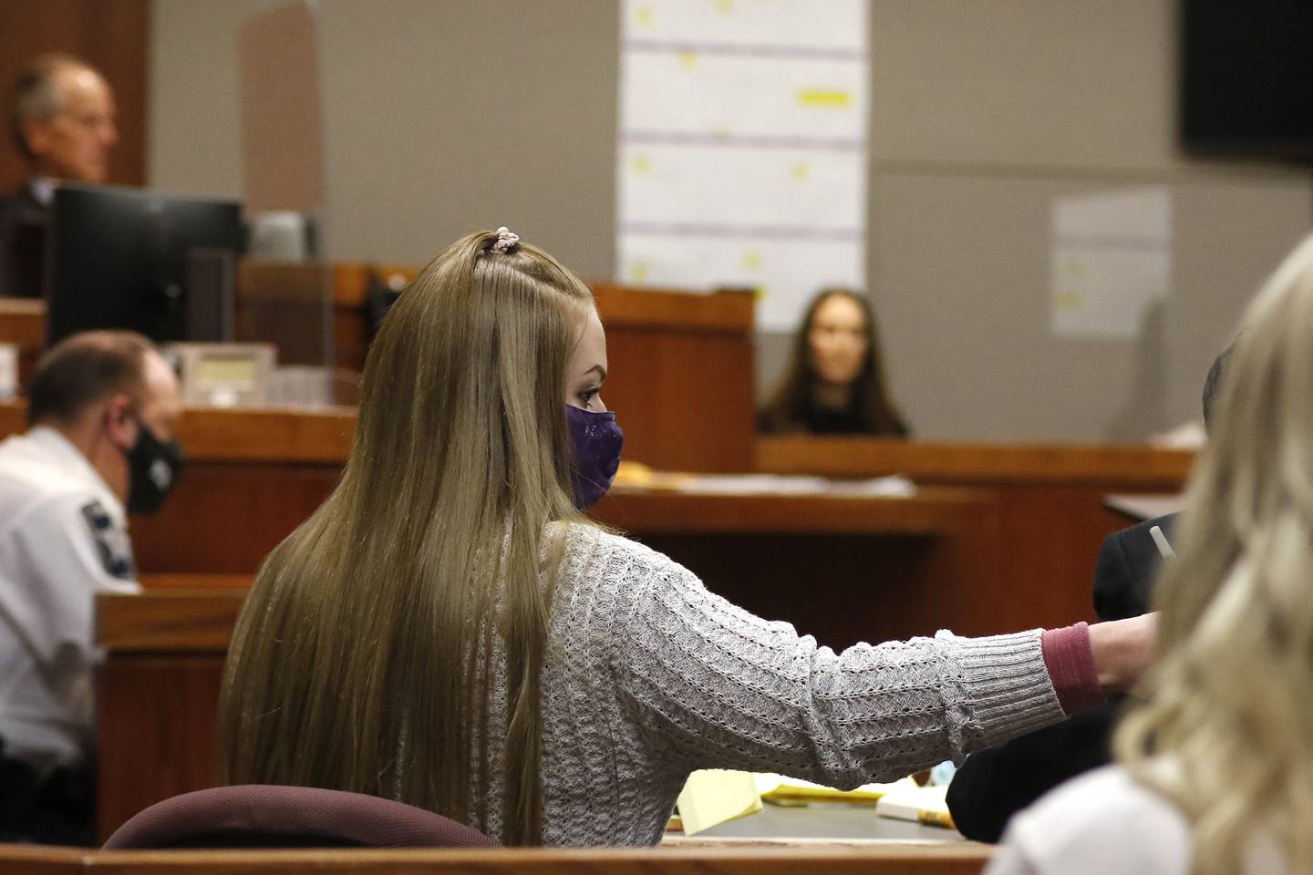 Veronica Kubiak sends a note over to attorney Scott Anderson during court with Judge Michael Coppedge Wednesday, Nov. 24, 2021, at the Michael J. Sullivan Judicial Center in Woodstock.