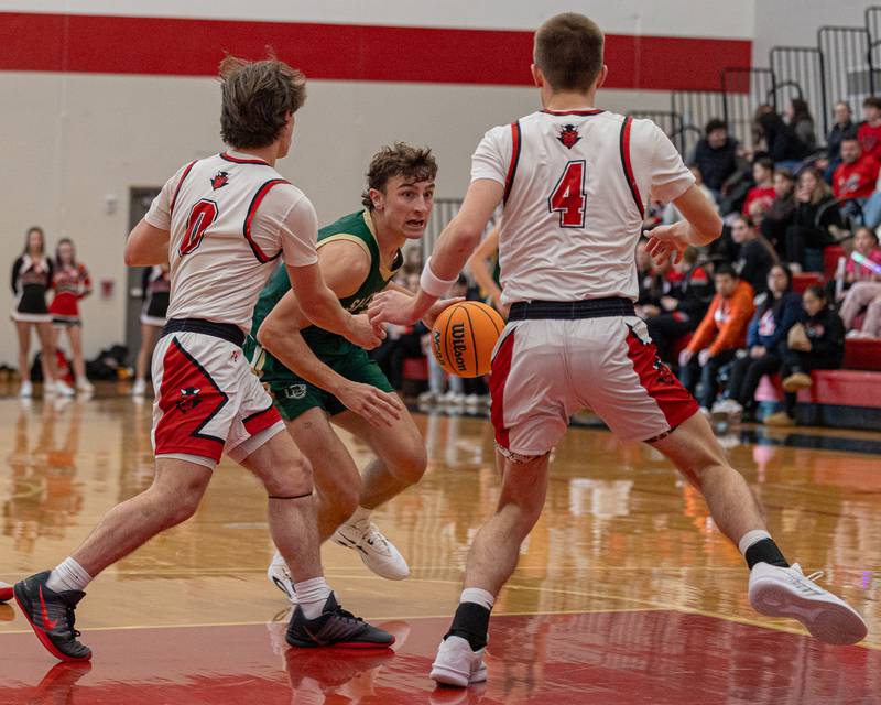 St. Bede's Gino Ferrari (4) dribbles ball whilst being double-teamed by Hall's Greyson Bickett (0) and Luke Bryant (4) on Saturday, January 31, 2026 at Hall High School in Spring Valley.